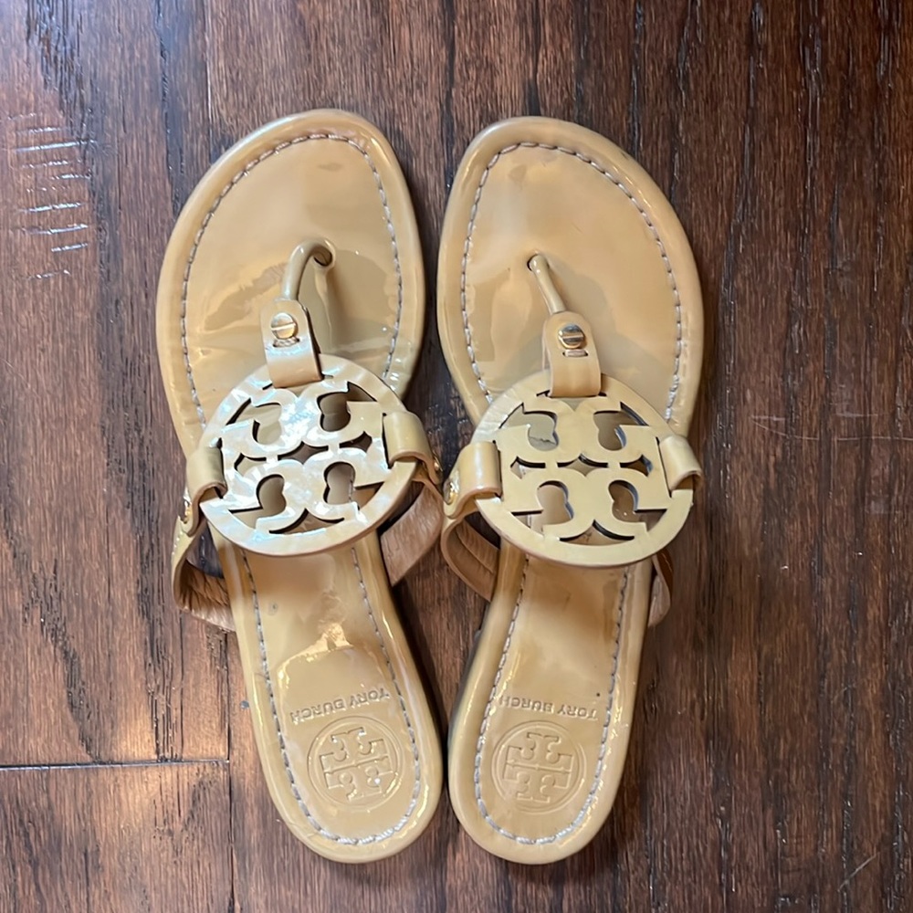 Tory Burch flats. In good condition with some wear.
